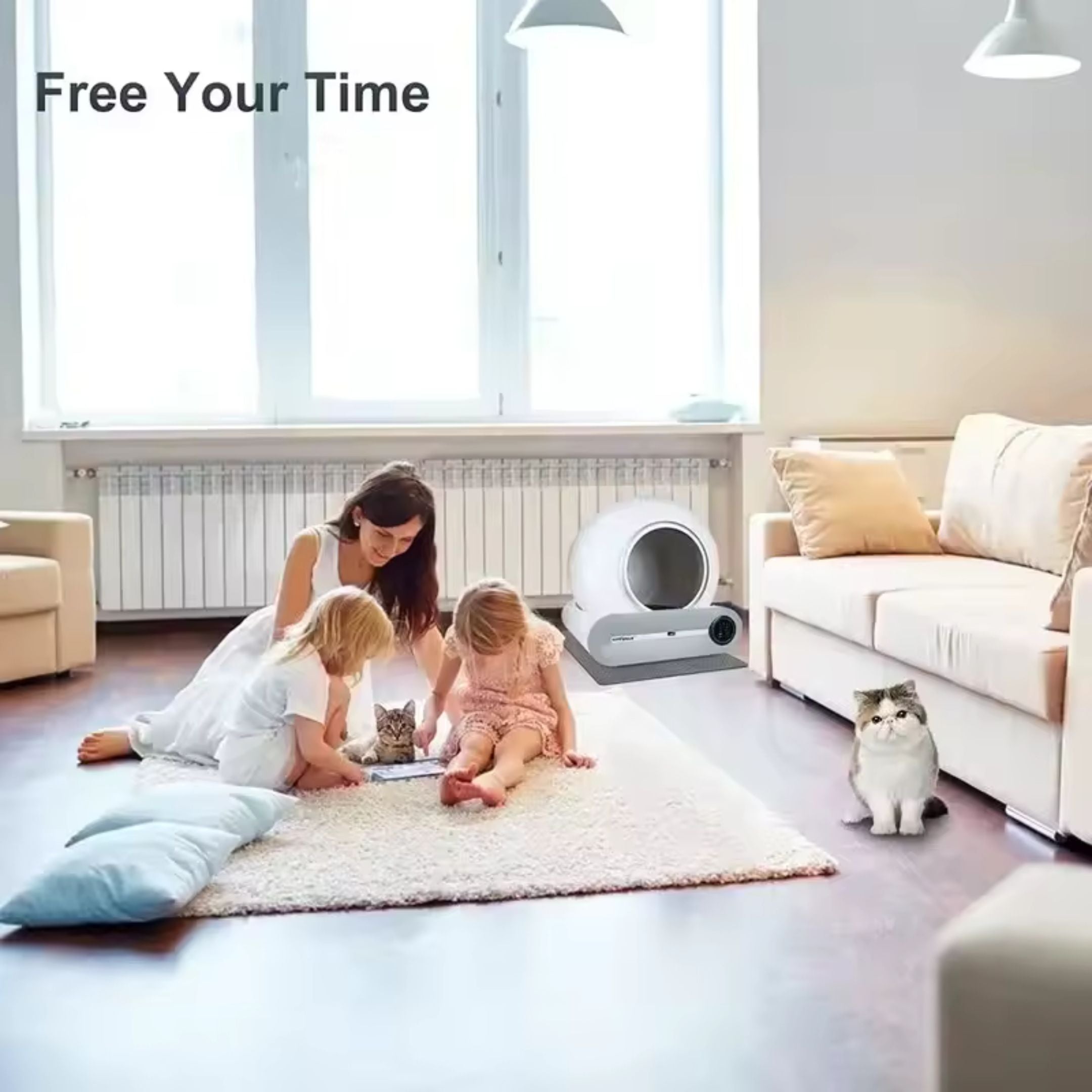 In a bright living room, a woman and two children pet a cat on a rug while another cat relaxes nearby. In the background, Strike Algos Automatic Cat Cleaning Litter Box is visible. The top left corner displays text: Free Your Time.