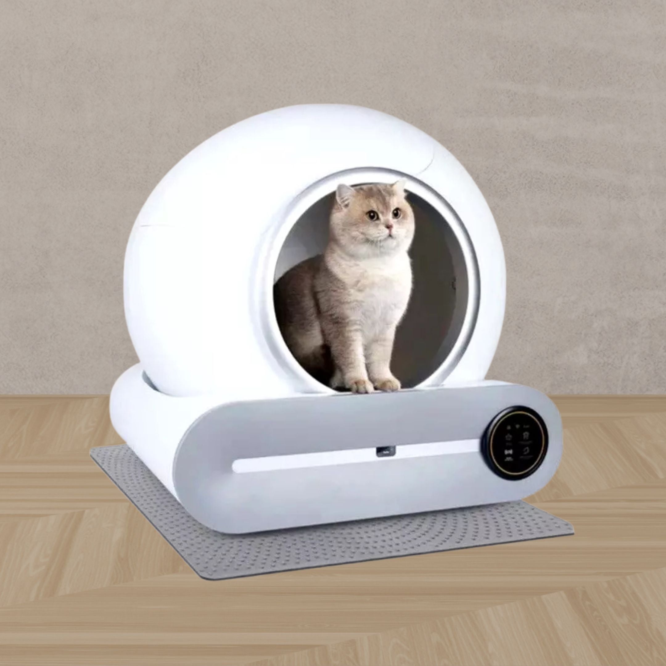 A cat relaxes inside the futuristic Strike Algo Automatic Cat Cleaning Litter Box with a circular opening. The box is on a gray mat atop a wooden floor, against a plain, textured wall.